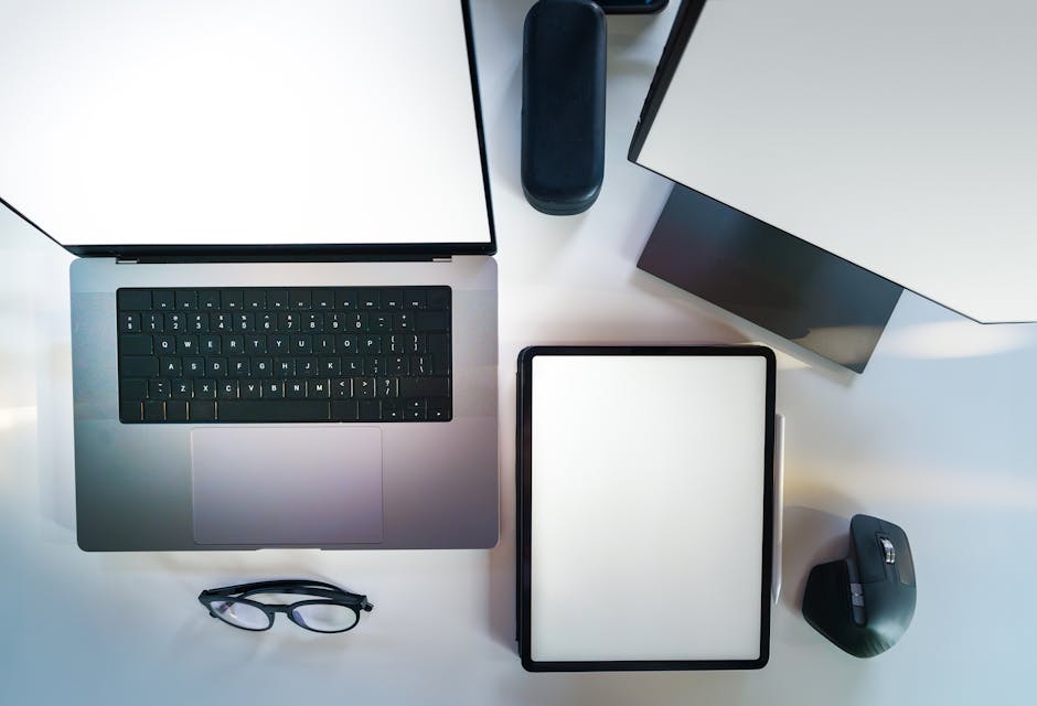 pexels photo 28454825 28454825 Top view of a sleek modern office desk with a laptop, tablet, and accessories.